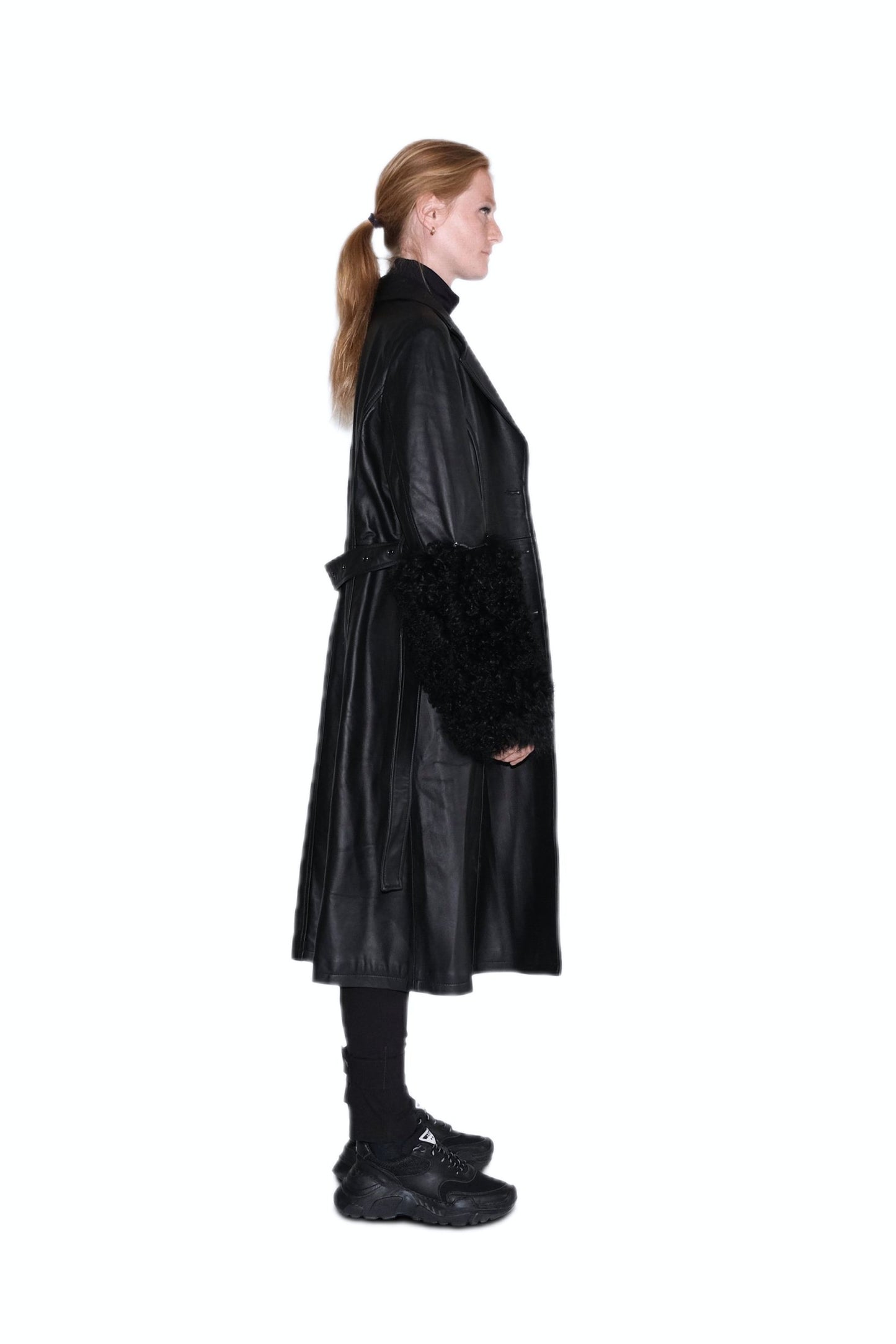 Black leather coat with lambswool fur cuffs for women by FRYA Studios